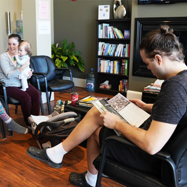 People seated in chiropractic office waiting area