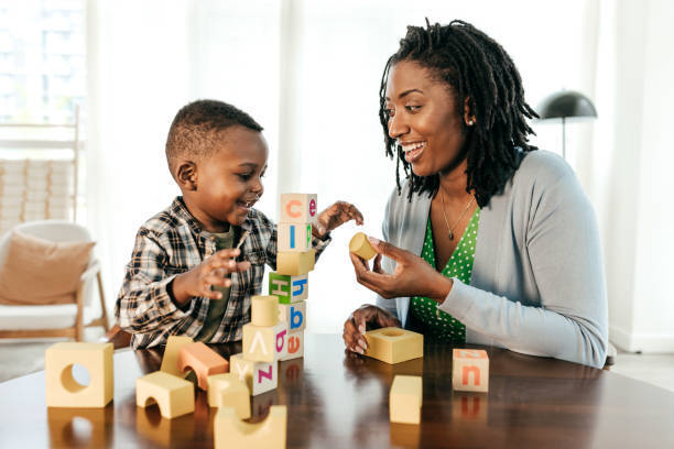 child and adult playing