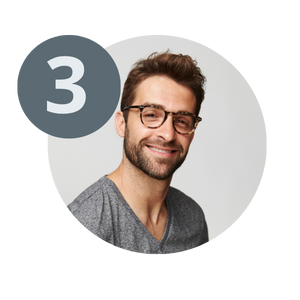man smiling and feeling relief after a podiatry visit while wearing glasses