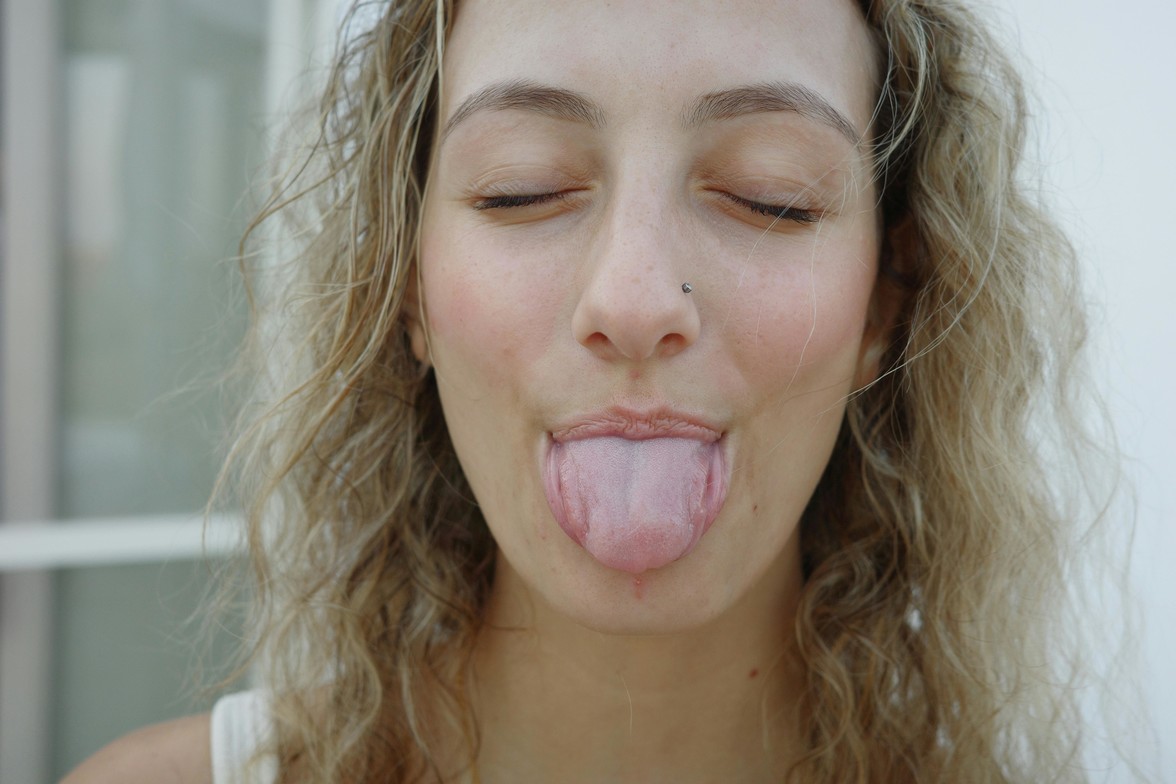 A woman sticking out her tongue