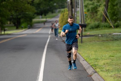 man-running-up-a-hill