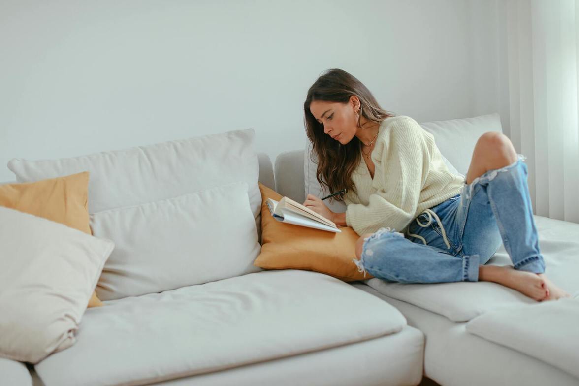 Adult journaling at home to reflect and manage stress between therapy sessions