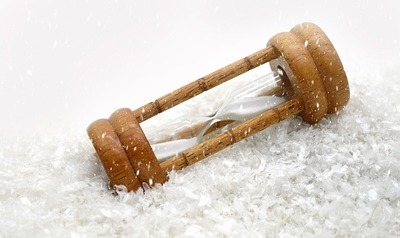 hourglass snow time representing duration of seasons or seasonal depression