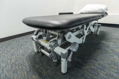 Treatment room at Audax Sport Medicine, Calgary, prepared for physiotherapy or massage sessions