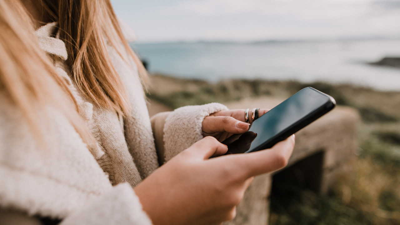 a women holding her phone 