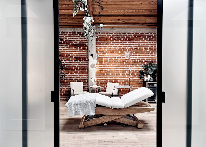 Clean, professional medical spa treatment room with neutral tones at Tulsi Wellness Club in Laguna Beach
