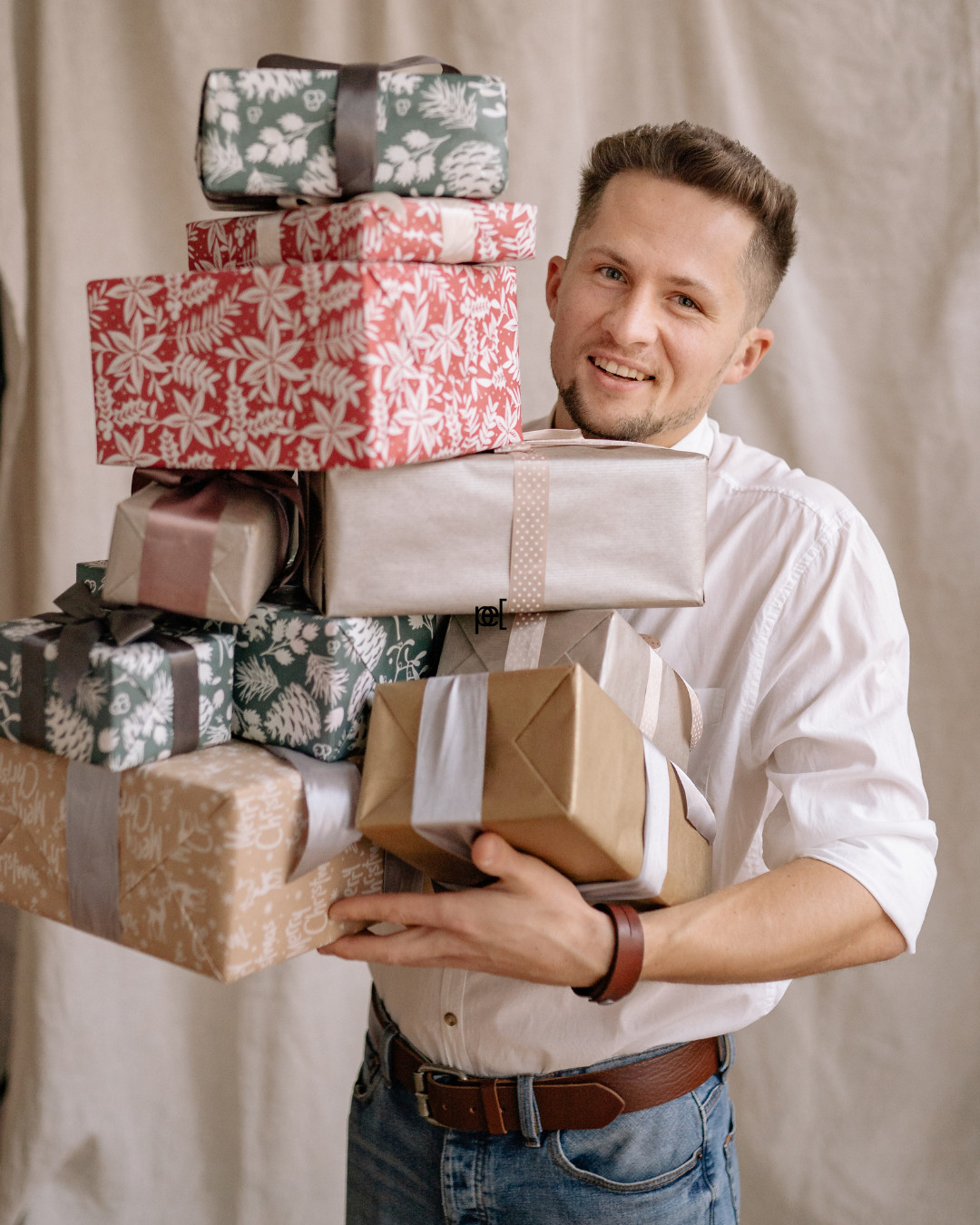 a guy carrying presents 