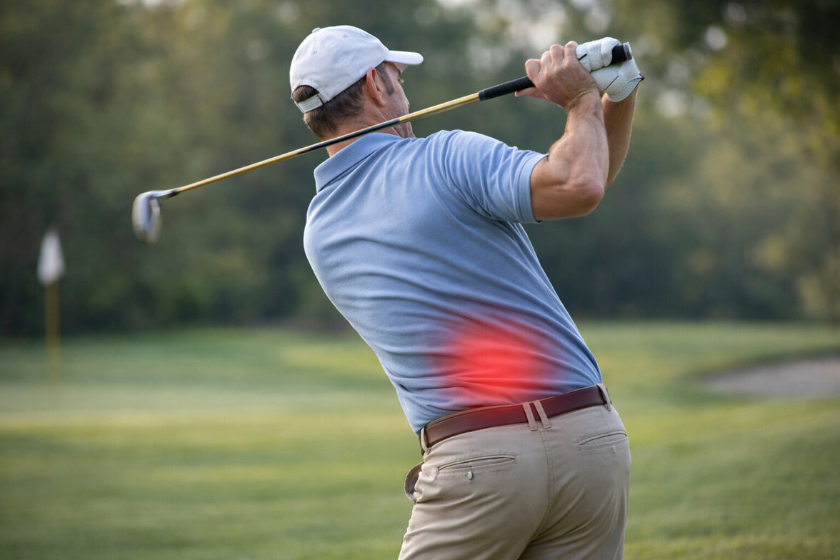 Golfer mid-swing with subtle red highlight at lower back