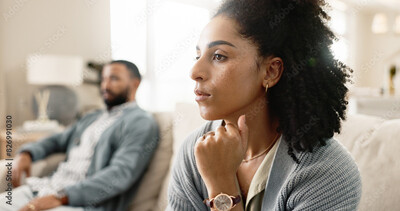 Image of a male and female in couples counselling looking intense