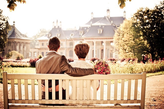 Couple sitting on a bench in Ottawa Ontario representing emotional connection