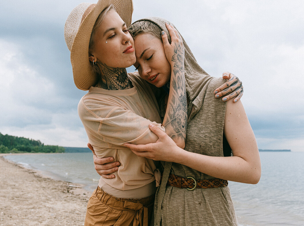 Two women embracing, symbolizing emotional safety and secure connection