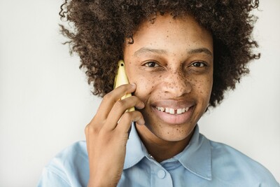 Girl on the phone making an appointment