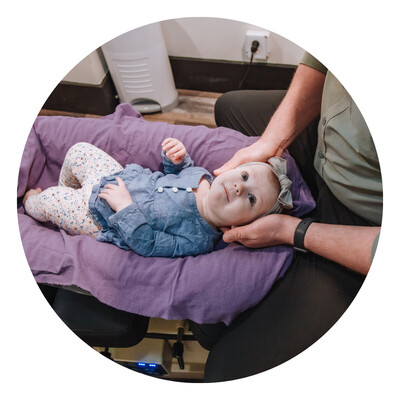 Child/Infant getting adjusted by chiropractor