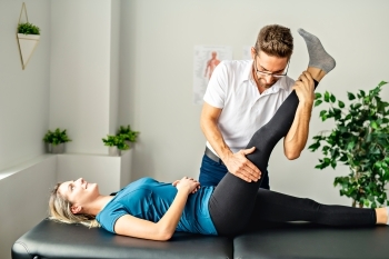 Chiropractor Stretching Hamstrings