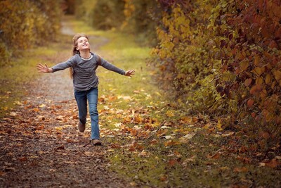 Child walking confidently outdoors representing emotional growth and wellbeing through counselling support