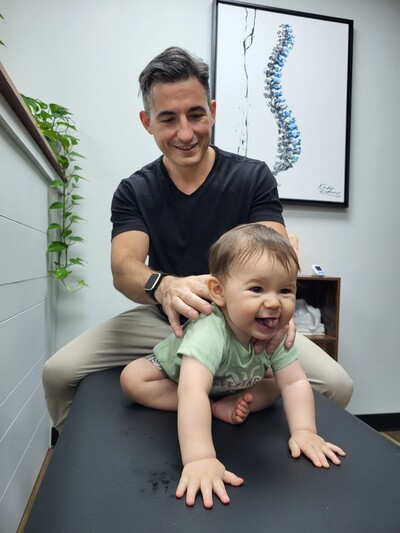 Image of dr mike sebastian assessing a pediatric patient