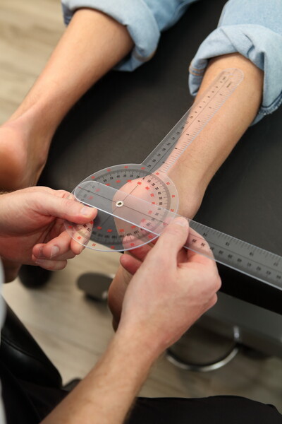 Clinician taking measurements of the foot 