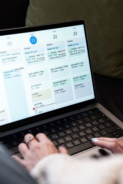 person scheduling appointments on a computer