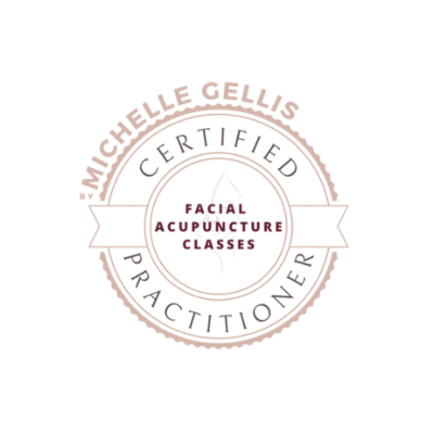 Circular certification logo reading ‘Michelle Gellis Certified Practitioner’ around the outer ring, with ‘Facial Acupuncture Classes’ in the centre and a stylised facial profile illustration, shown in soft pink and white on a transparent background