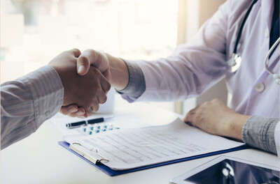 Medical provider shaking hands with a patient, representing preventative care, wellness coaching, weight loss, hormone therapy, stress prevention, and DOT driver wellness programs near Charlotte NC at Bella Medical Associates.