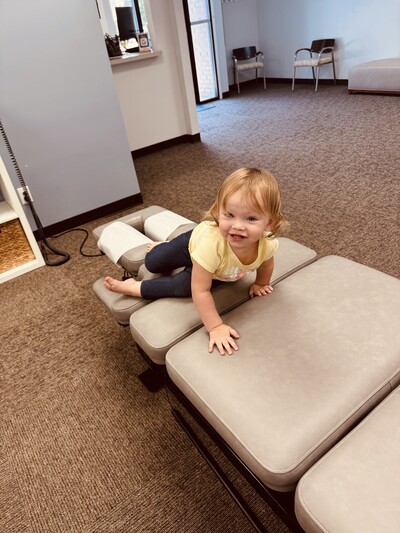 Pediatric chiropractor Dr. Christina Lowenthal adjusting an infant at Vitalise Chiropractic in Virginia Beach.
