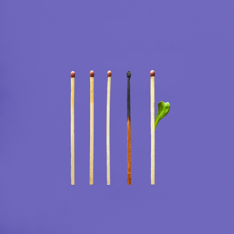 5 matches, one burned, on a purple background