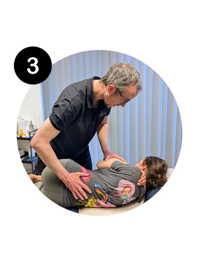 Chiropractor Adam performing targeted spinal manipulation on a patient to support their recovery at Handsworth Chiropractic Clinic.