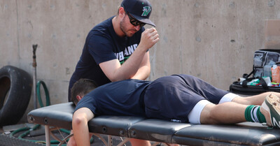 Sports physiotherapist trevor kwolek providing hands-on athletic injury treatment during a training session at Great North Physiotherapy in St. Catharines.