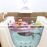 Baby enjoying hydrotherapy at Dolphin Dive Baby Spa in London, Ontario