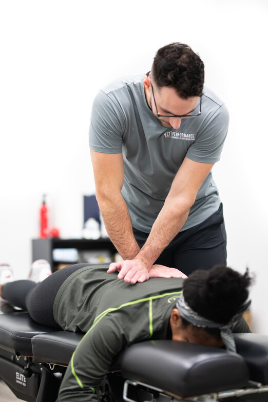 Patient working with a provider at a sport chiropractic clinic in Springfield, MO 
