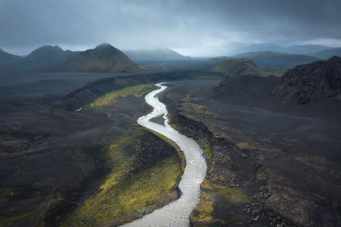 A solitary path winding through a peaceful landscape, representing moving forward despite intrusive thoughts and anxiety