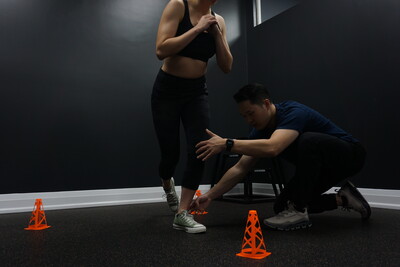 Male chiropractor providing sports therapy training