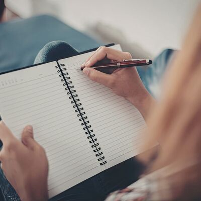 Person preparing thoughtfully for their hypnotherapy session process