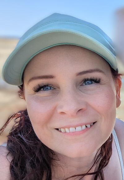 headshot of Crystal Stauch, a Registered Massage Therapist in SE Calgary, smiling warmly.