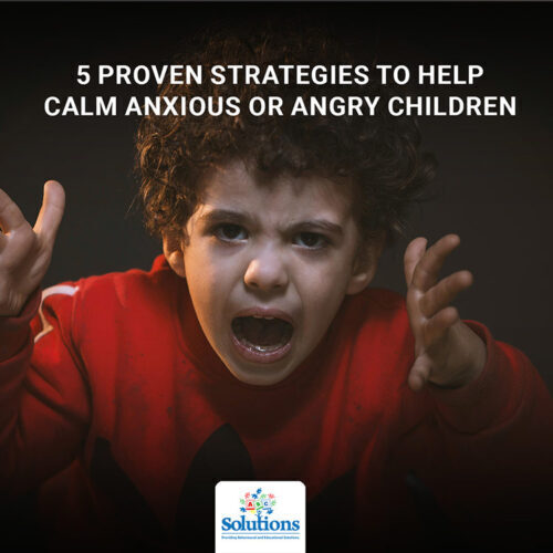 Child screaming with hands over their ears