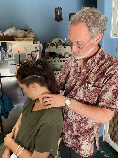 Dr Feldman working on a patient