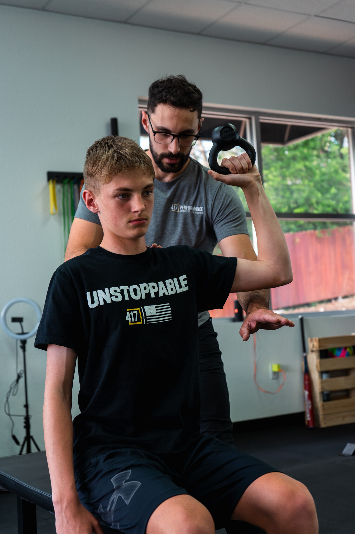 Patient working with a provider at a sports rehabilitation clinic in Springfield, MO during a return-to-sport exercise session