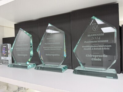 Display of Markham 2024 Platinum Winner awards for chiropractic and naturopathic clinic