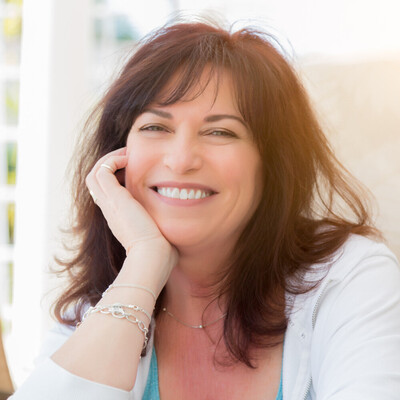 Woman feeling calm and free after hypnosis to quit smoking in Canada