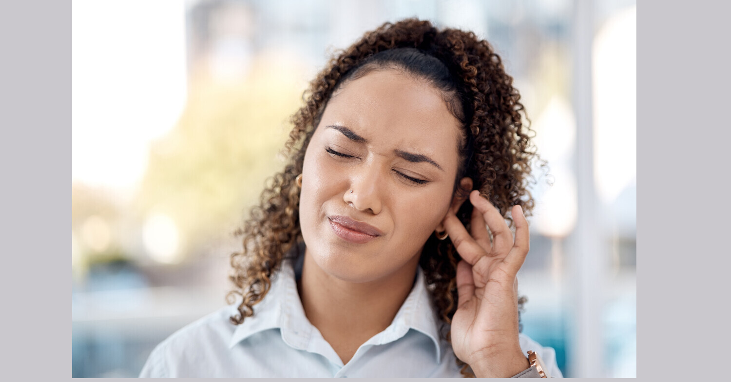 Woman with ear pain and tinnitus