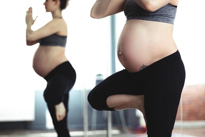 Pregnant woman performing yoga