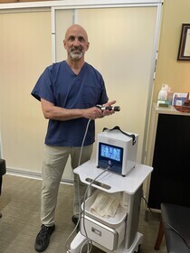 Dr Cohen with a shockwave machine