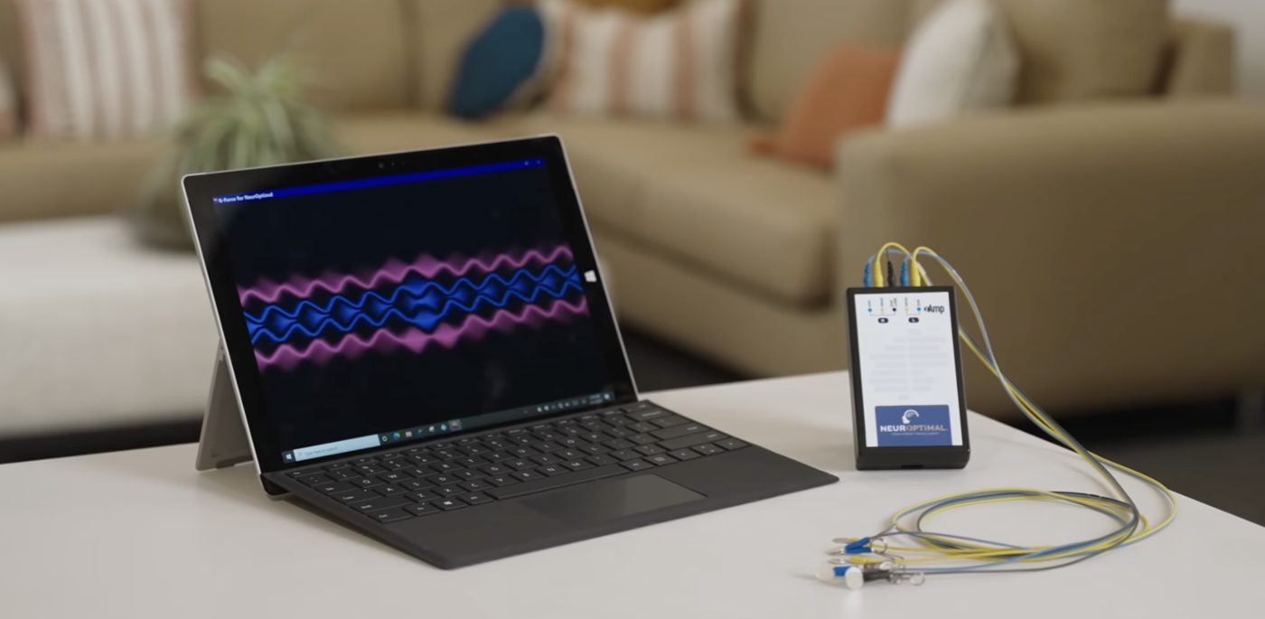 NeurOptimal neurofeedback setup with a laptop and amplifier
