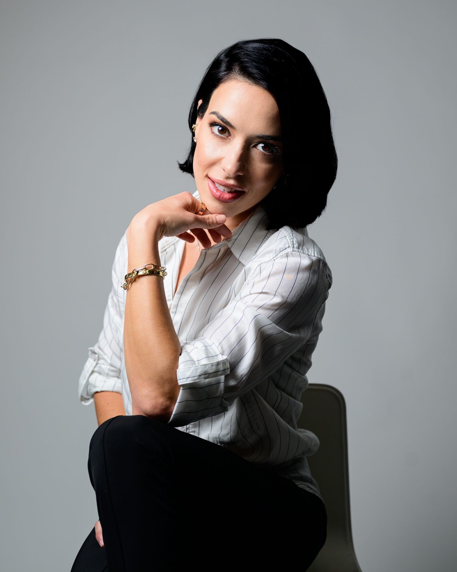 Sofia Gadelov, seated, in a white shirt