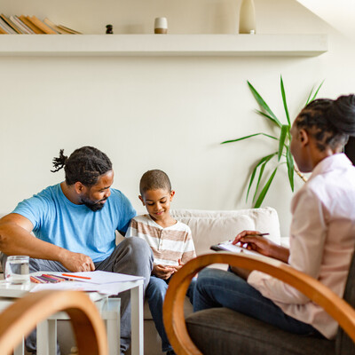 Family sitting together on a couch